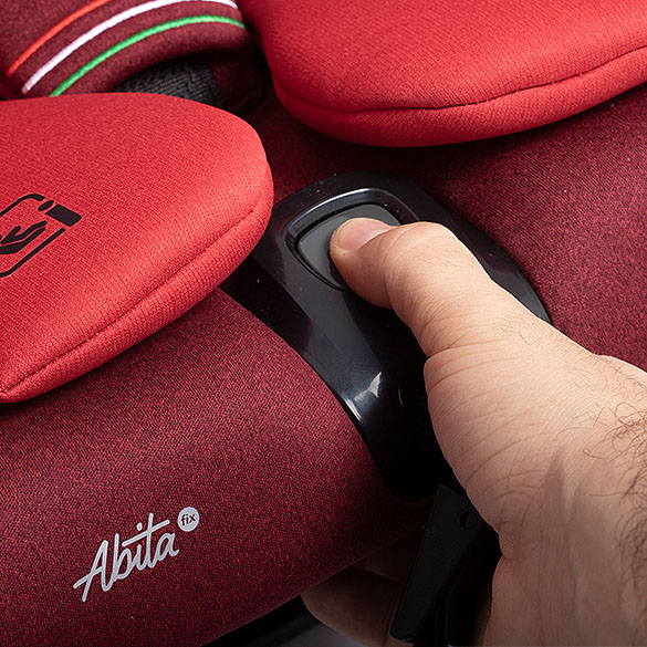 ABITA car seat Tango Red. Harness adjustment button detail